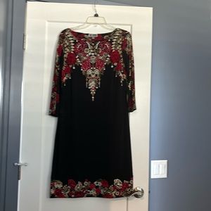 Dress has clear rhinestones for added flare.